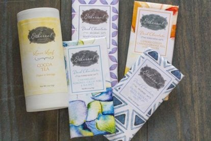 Ethereal Chocolate Bars and Cocoa Tea against blue wood backdrop