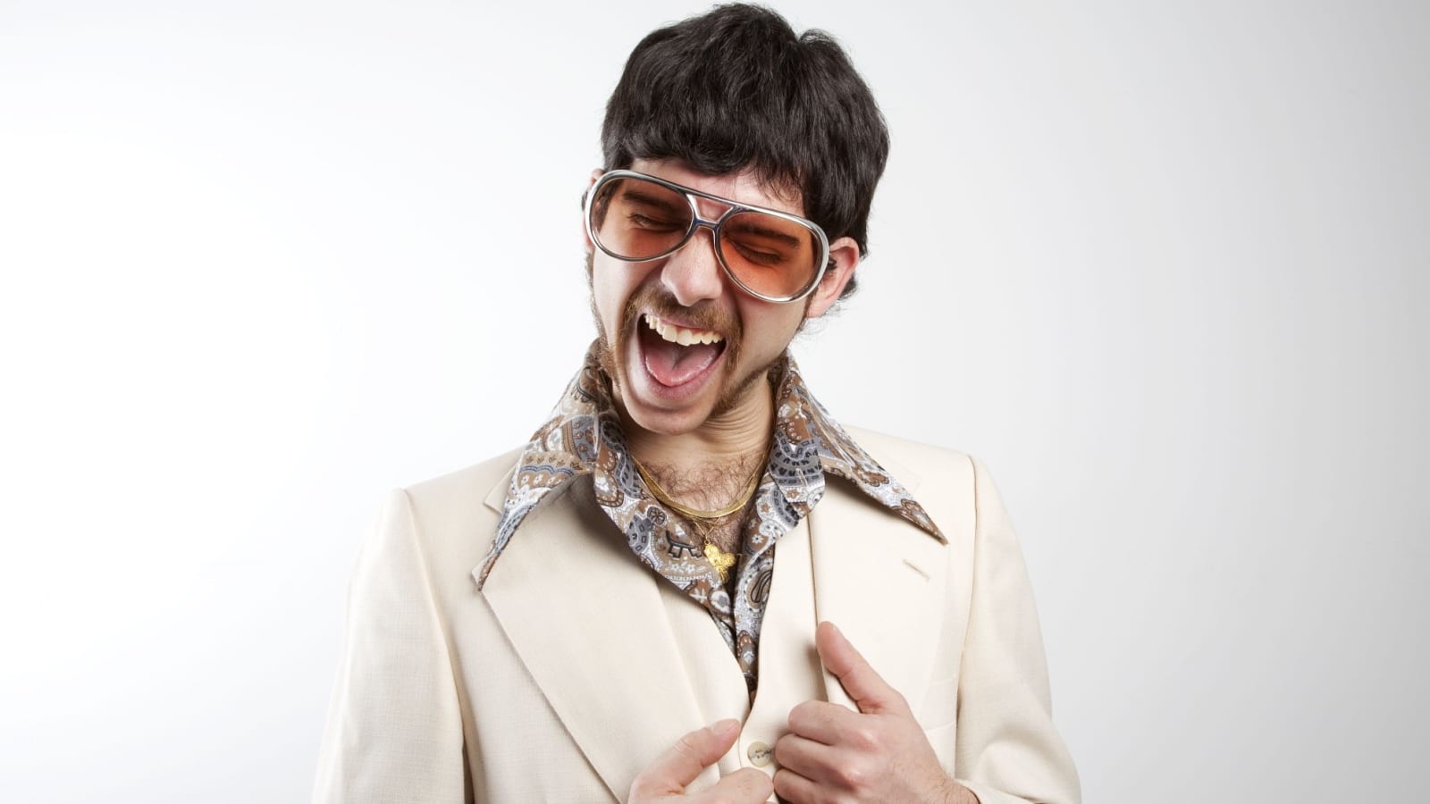 Excited man in leisure suit.