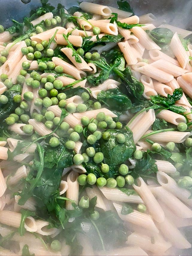 low FODMAP Pasta Primavera cooking; stir in the peas