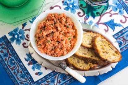 Low FODMAP Salmon Rillettes in white bowl with toasted baguette; pearl handled knife alongside